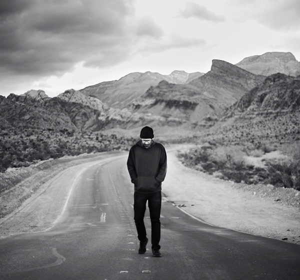 man walking on a road